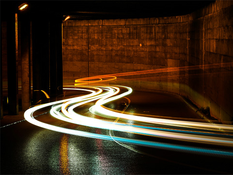 Lights moving fast through a tunnel